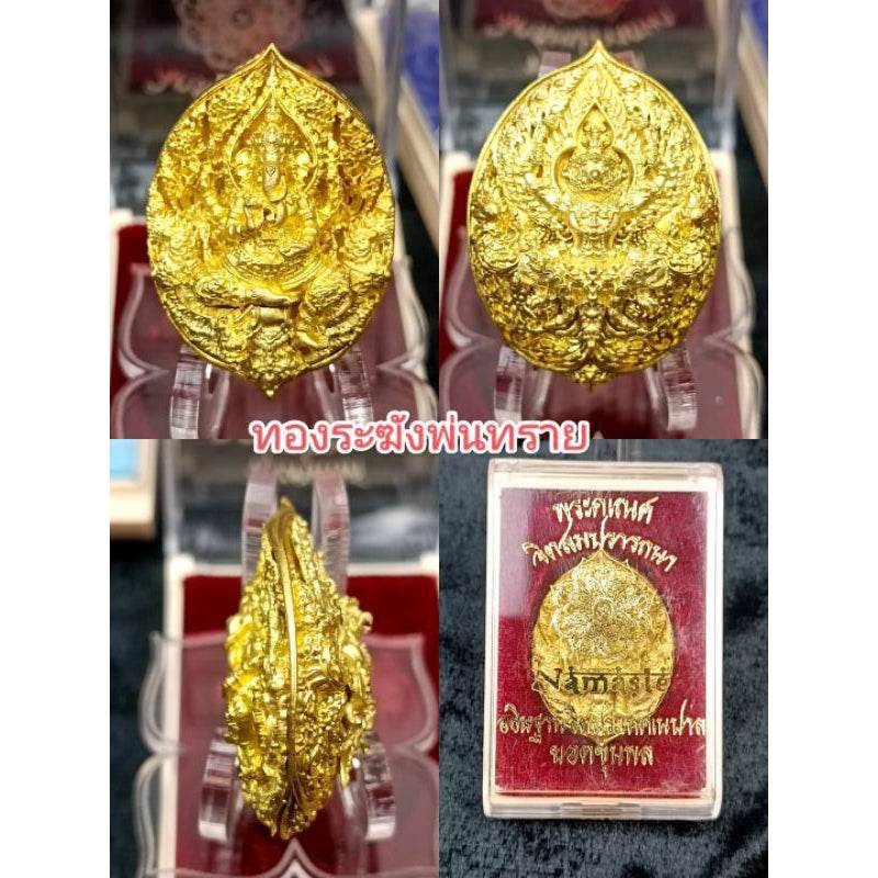 Premium Buddhist amulet for prosperity with intricate gold design and detailed carvings in display case