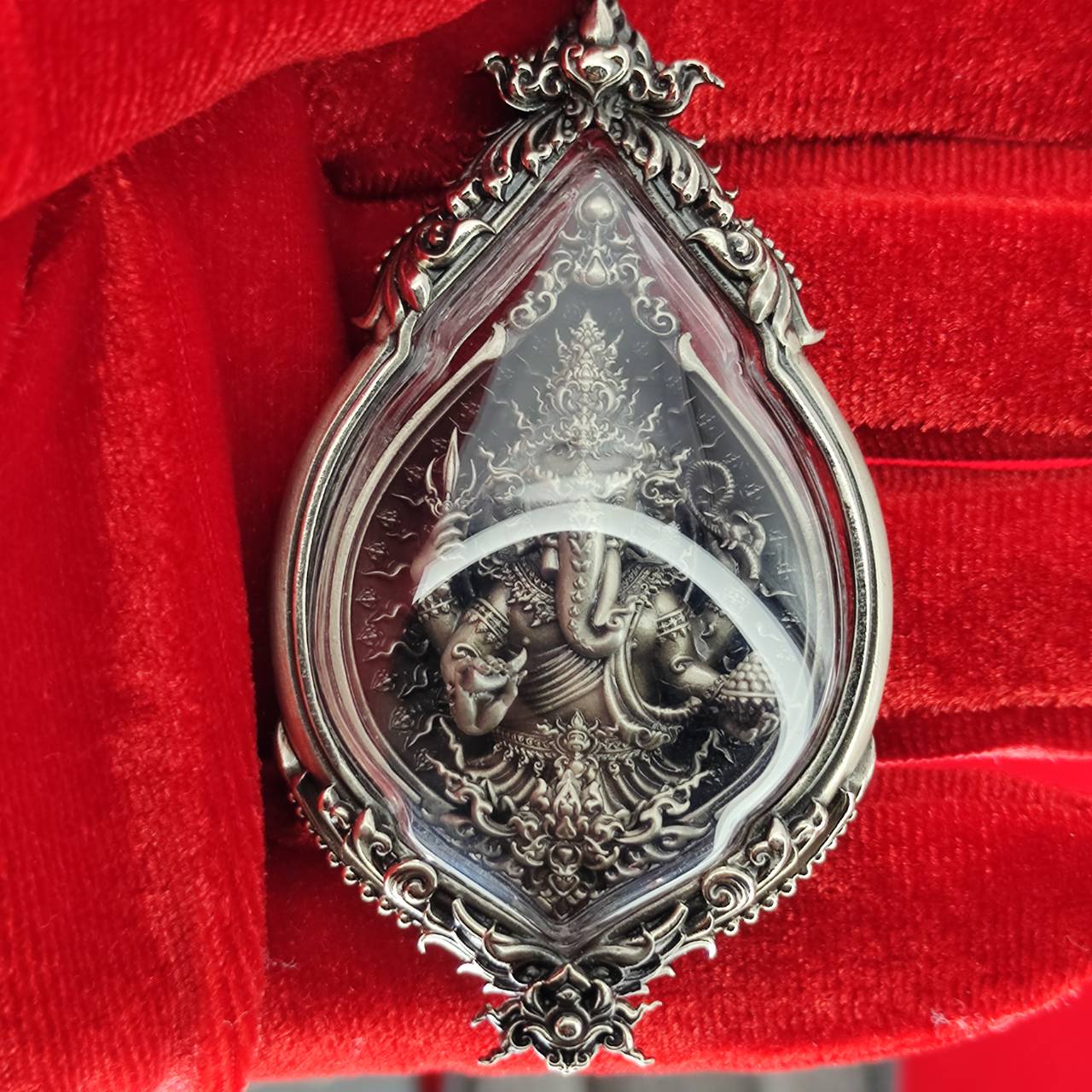 Prosperity Ganesh pendant Thailand in an elaborate silver frame, featuring intricate details of Lord Ganesh.