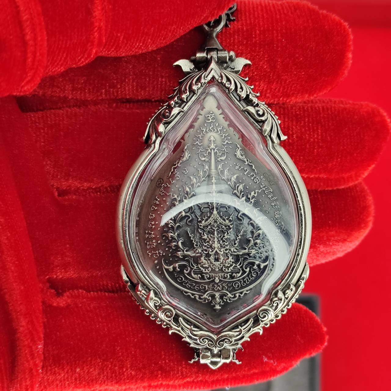 Prosperity Ganesh pendant Thailand in ornate silver casing with intricate designs for spiritual decor