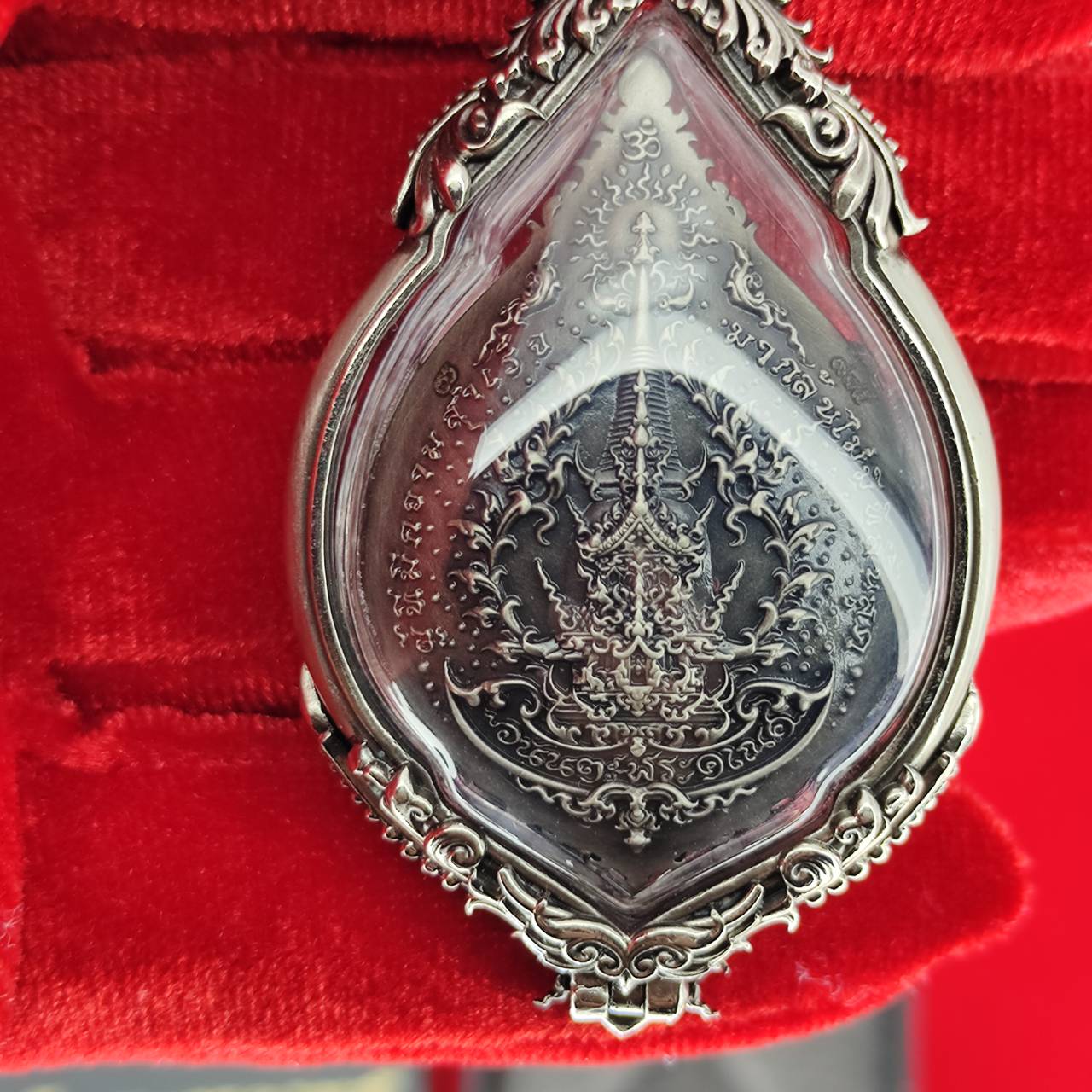Elegant prosperity Ganesh pendant Thailand featuring intricate designs in a protective case