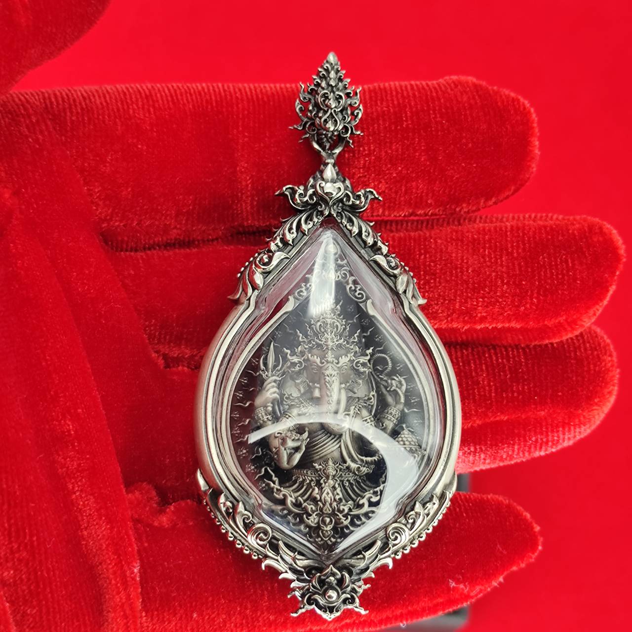 Prosperity Ganesh pendant Thailand in ornate silver setting, showcasing intricate carving and clear crystal design