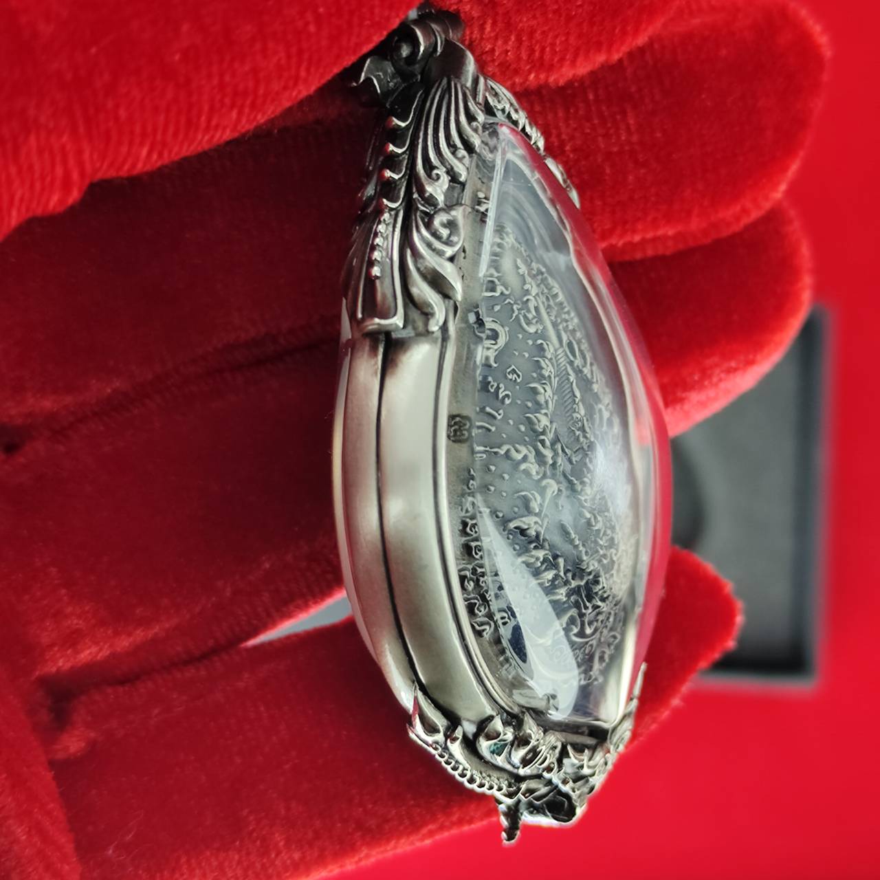 Prosperity Ganesh pendant Thailand with intricate silver detailing and protective casing