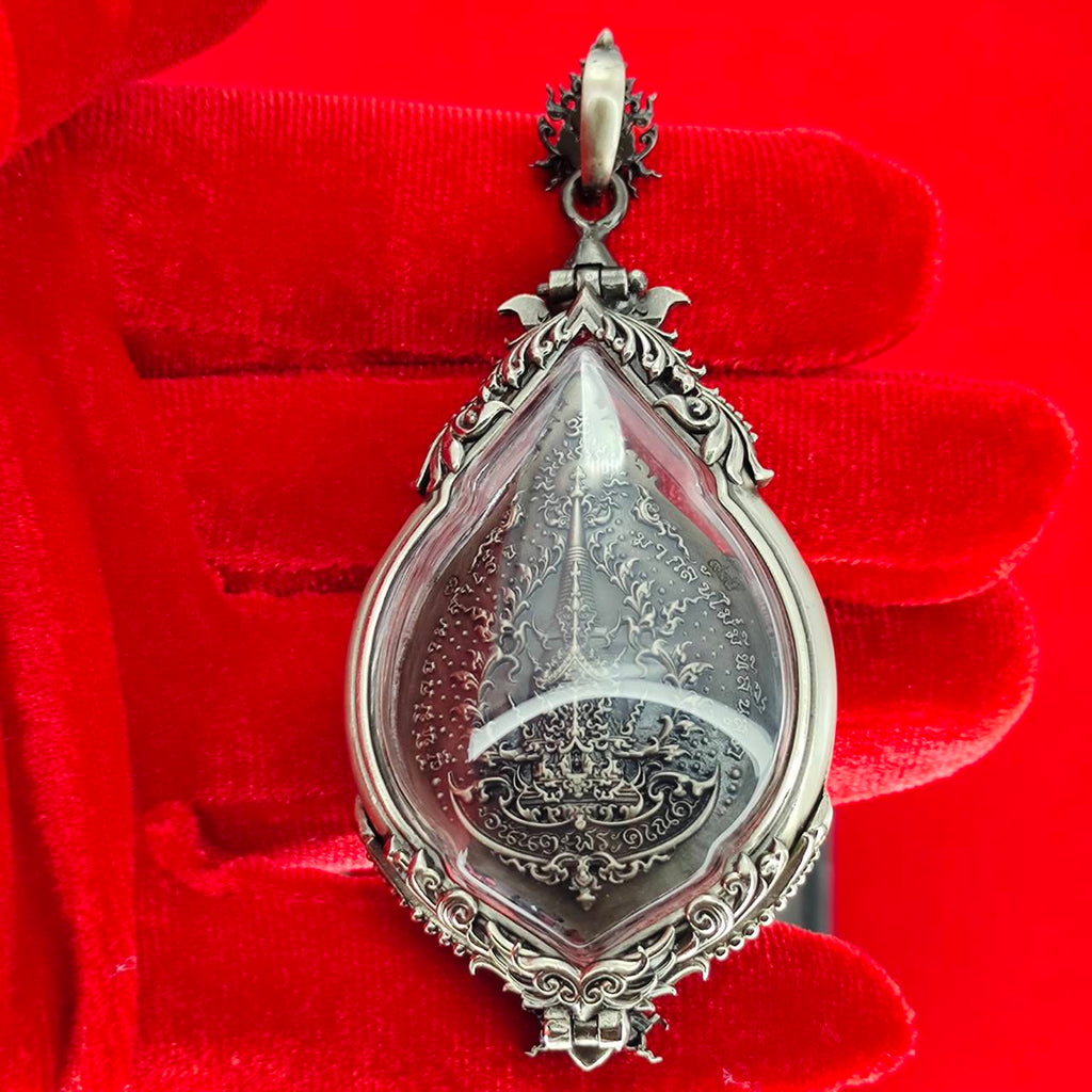 Prosperity Ganesh pendant Thailand featuring intricate silver detailing and protective casing