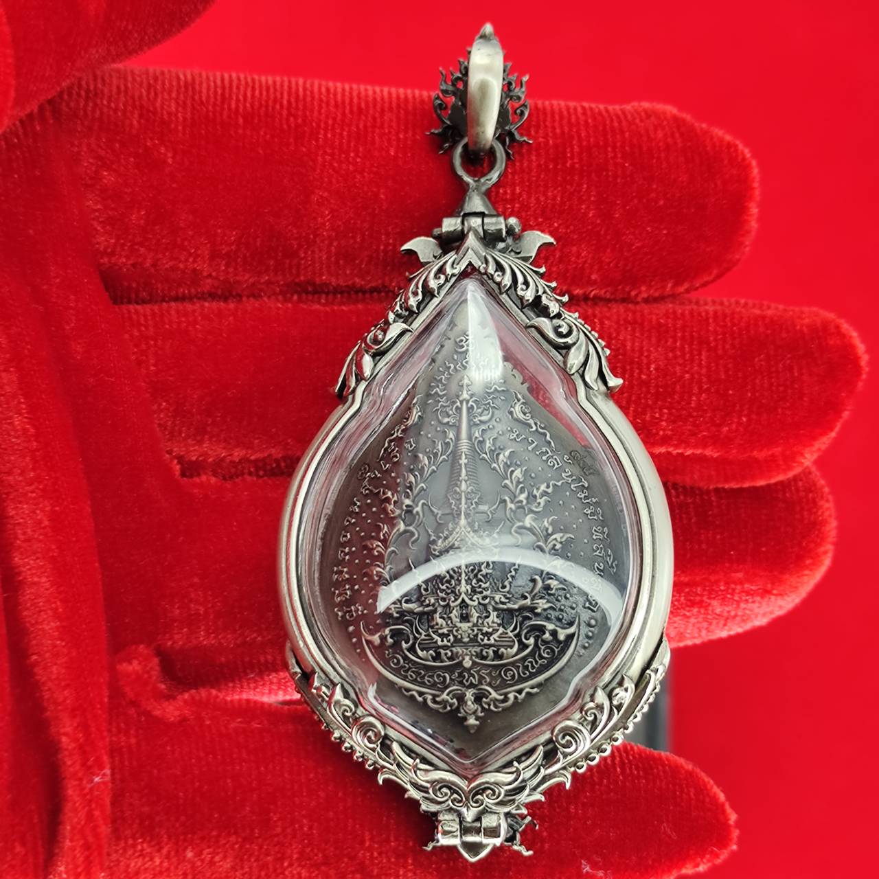 Prosperity Ganesh pendant Thailand featuring intricate silver detailing and protective casing