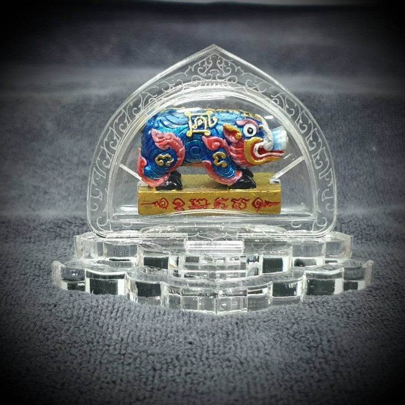 Colorful prosperity pig lucky charm Thailand displayed on a decorative stand for good fortune and success