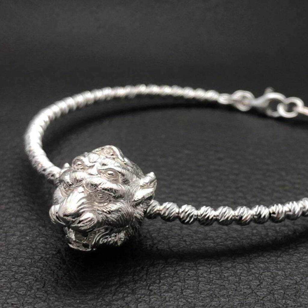 Si Hu Ha Ta bracelet by Master Subin featuring a silver animal head design on a twisted band