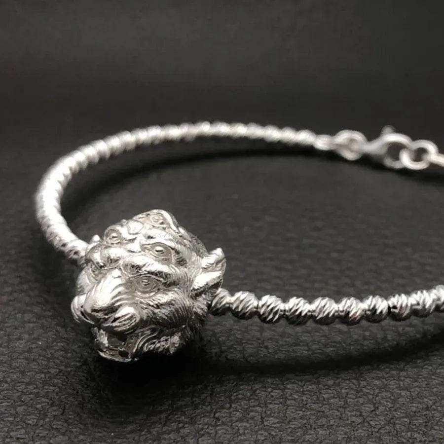 Si Hu Ha Ta bracelet by Master Subin featuring a detailed silver tiger head design on a twisted band