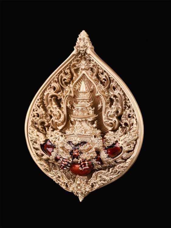 Intricately designed Rahu medallion for fortune and protection with ornate carvings and gemstones