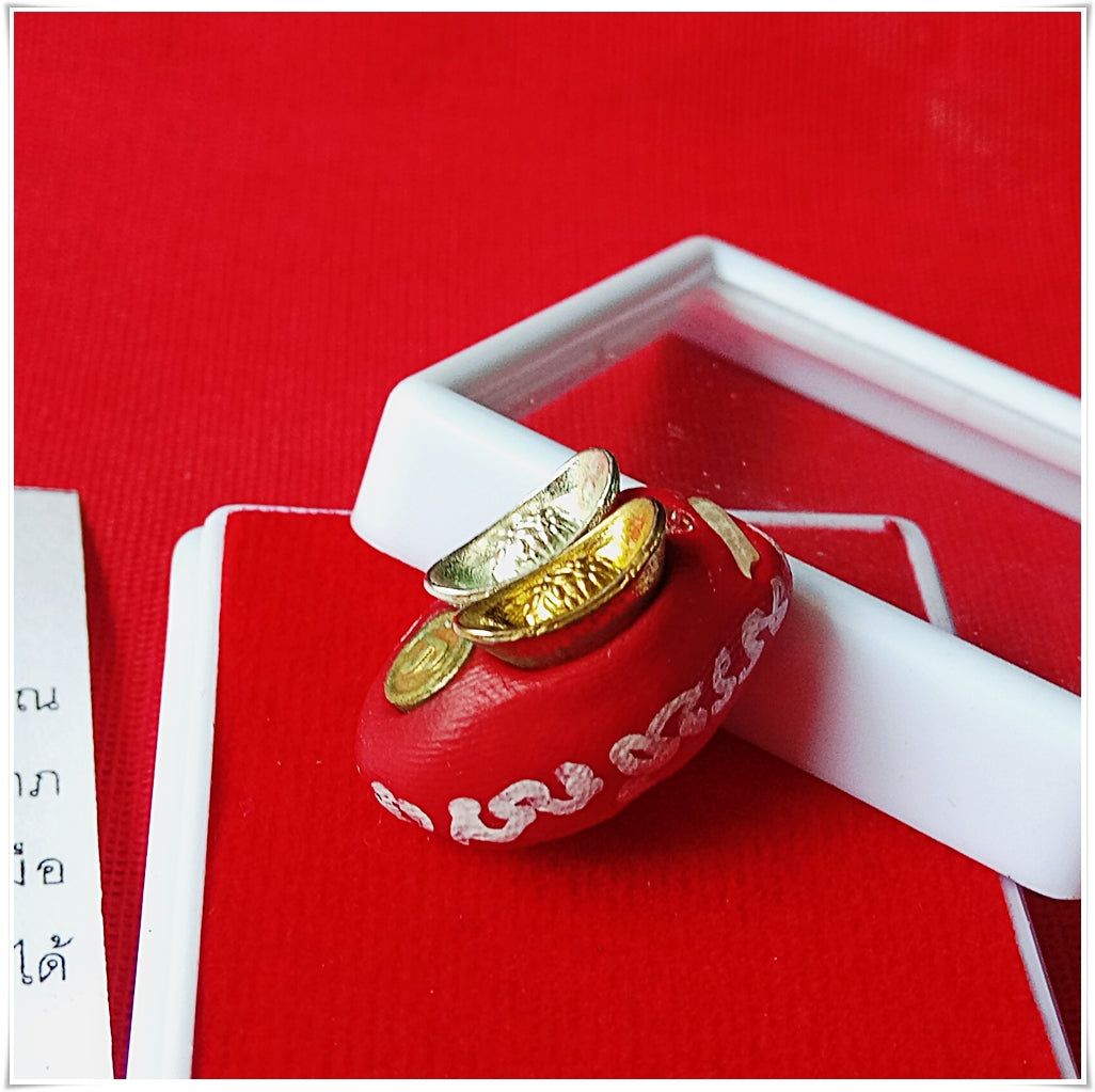 Thai Blessing Co red pouch amulet with gold coins and white detailing lucky millionaire amulet for wealth