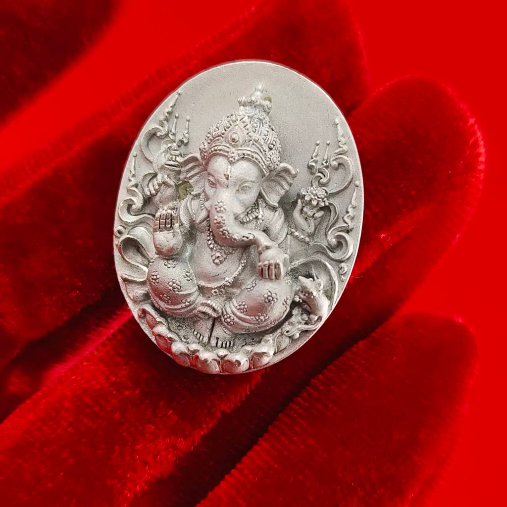 Sacred Ganesha talisman for fortune crafted in silver with intricate detailing and ornate design