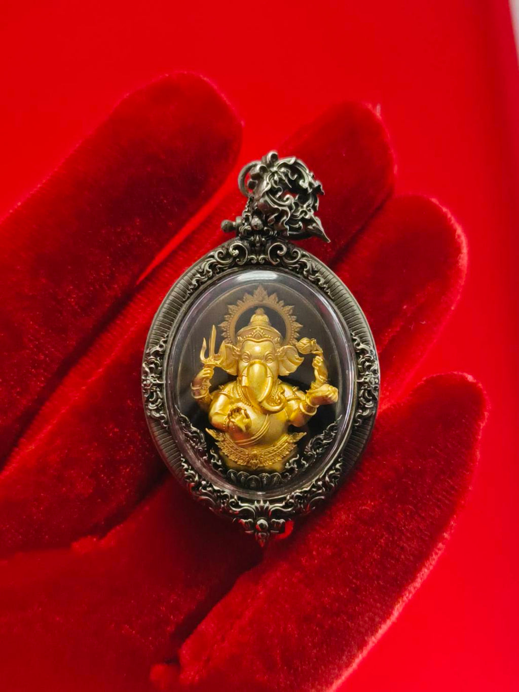 Ornate metal framed Thai Ganesh pendant white satin gold amulet in oval case on red velvet glove