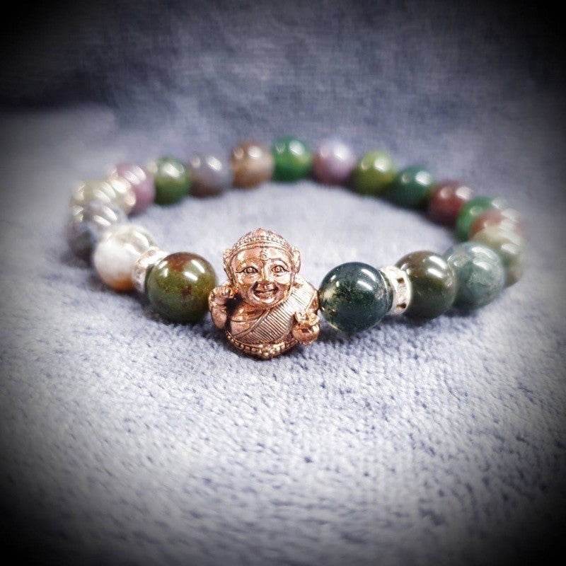Thai prosperity bracelet for business success featuring colorful beads and a charm