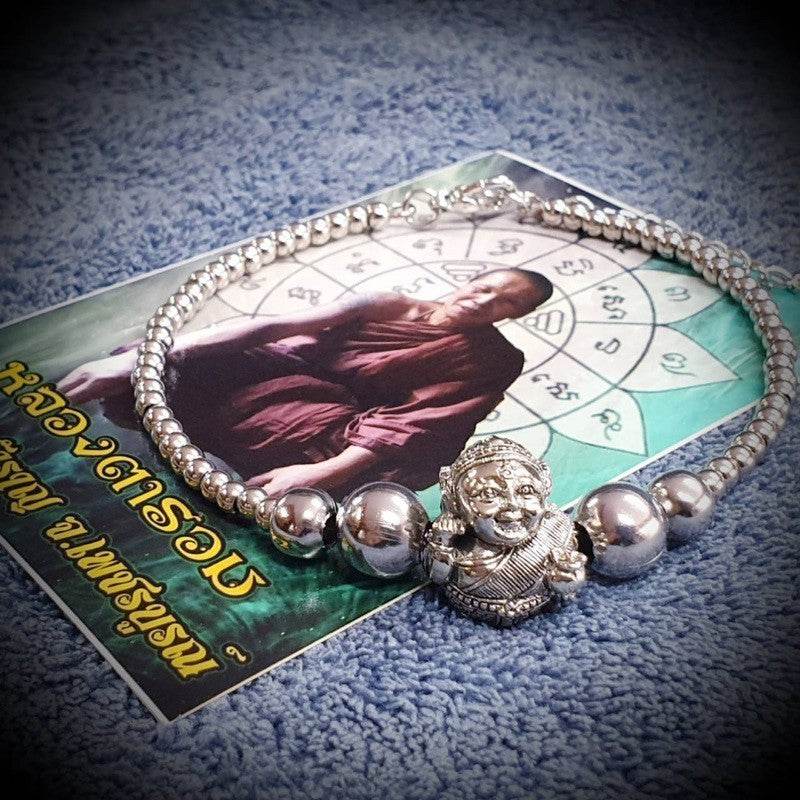 Thai prosperity bracelet for business success with a silver design and Buddha charm