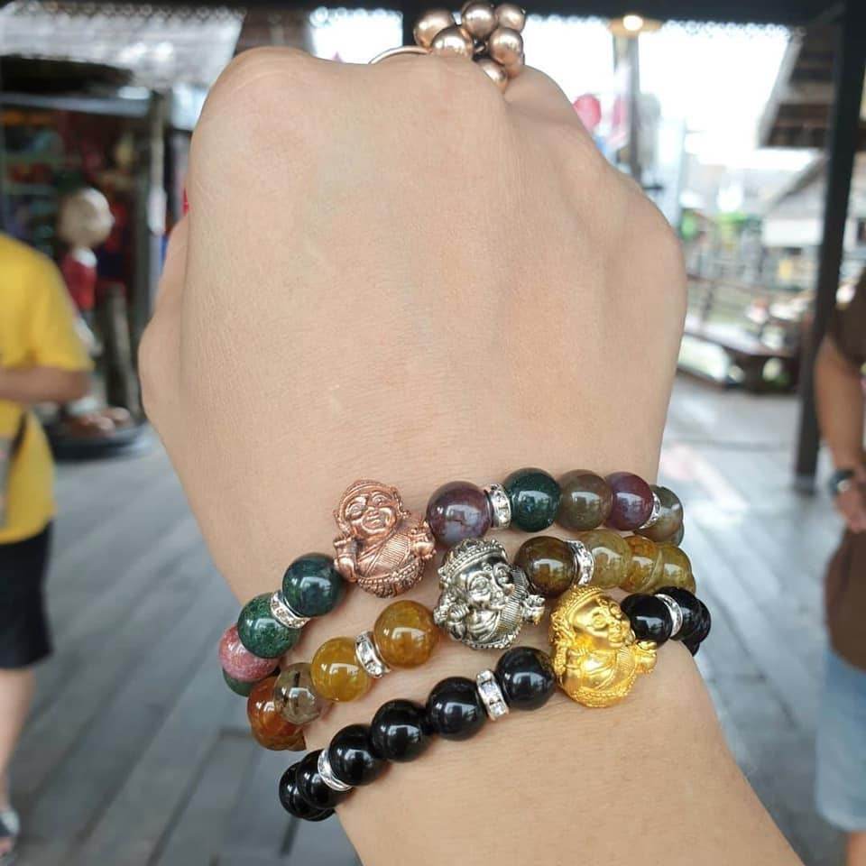 Set of Thai prosperity bracelets for business success featuring colorful beads and decorative charms