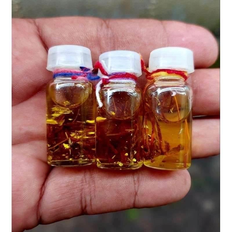 Lucky Bandit Oil Charm - Prosperity and Protection by Phra Ajarn Prasutti, Wat Nai Tao, Trang (B.E. 2547 Edition) Default Title