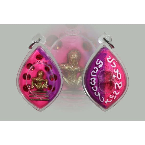 Thai golden face charm pendant with purple and pink casing featuring red stones and inscriptions