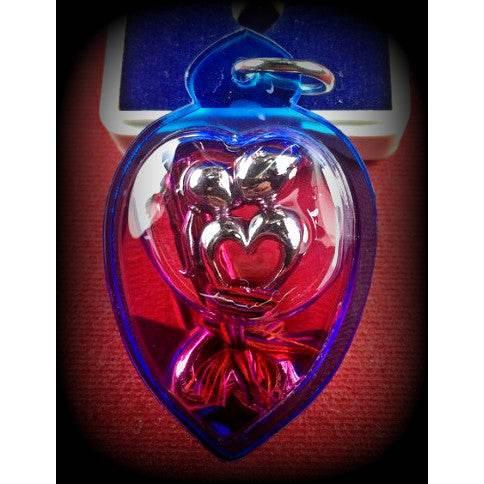 Dual Charm Thai Love Pendant - Elegant Twin Figures in Herbal Oil Casing | 泰式双人魅力吊坠 - 植物精油封装的双体工艺饰品