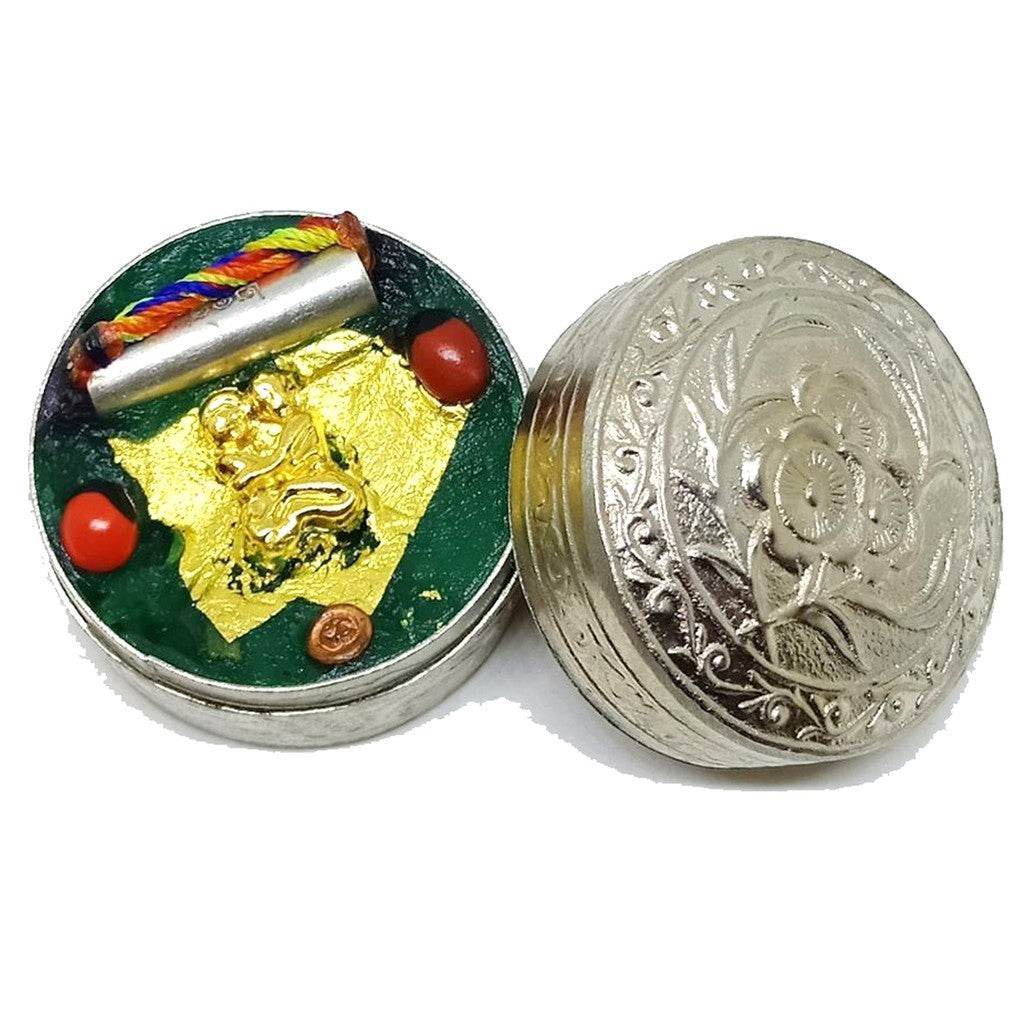 Si Phueng Nang Rap authentic Thai amulet in a decorative metal container with colorful charms