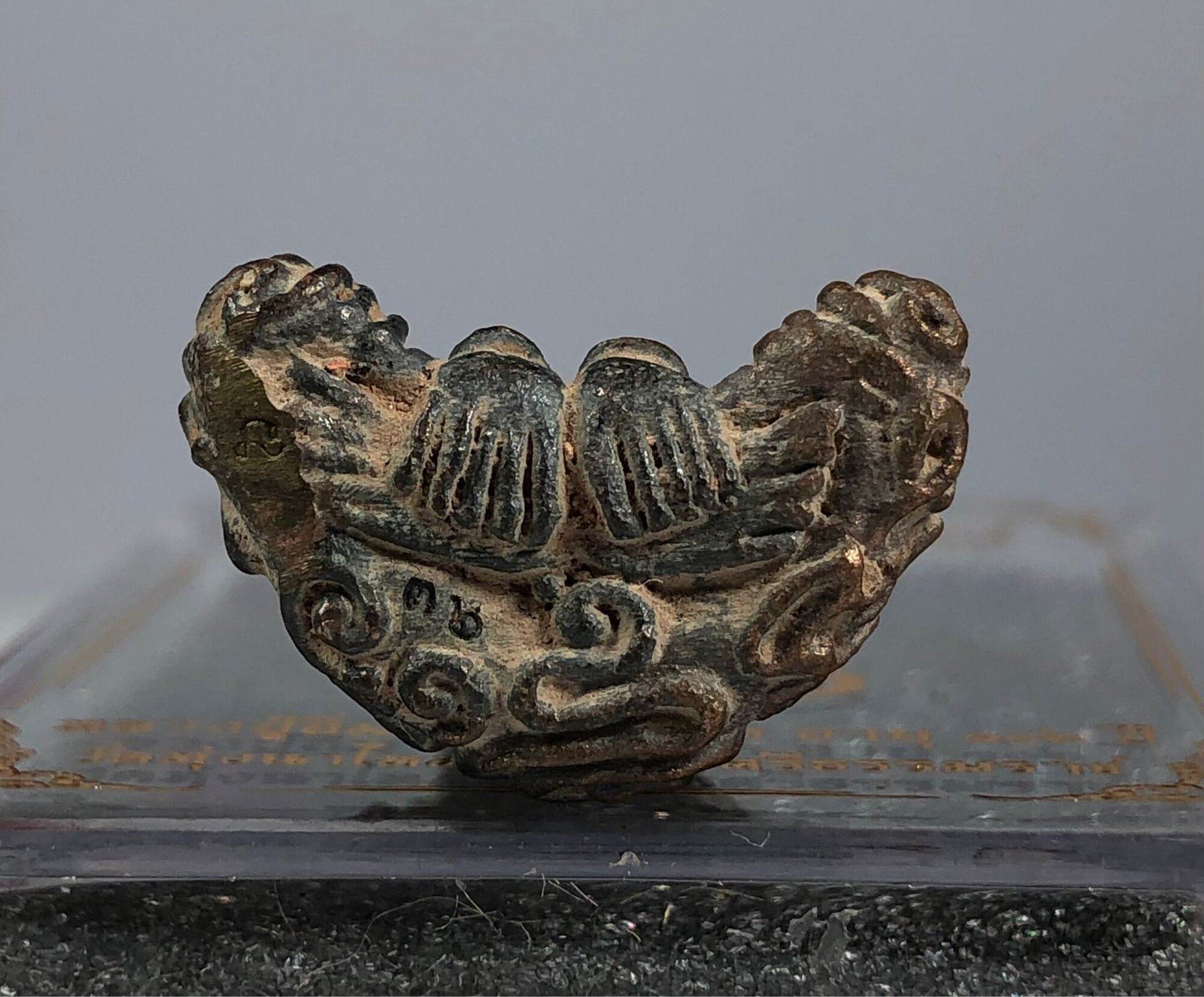 Antique Phra Pidta Maha Uthom Amulet - Yung Yan (One of Siam's Sacred Symbols) small worn bronze talisman with hands covering face