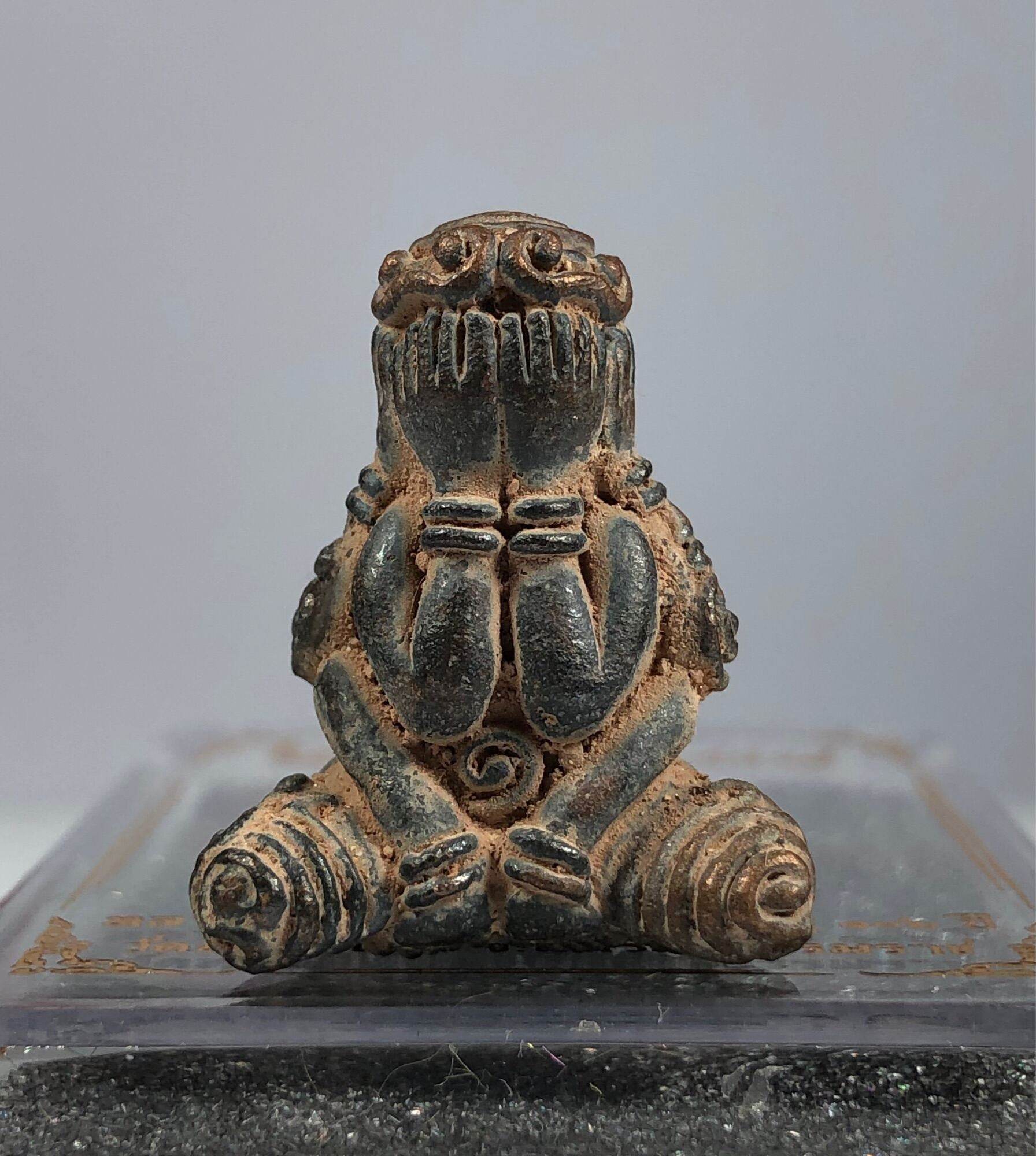 Phra Pidta Maha Uthom Amulet - Yung Yan (One of Siam's Sacred Symbols) seated amulet with hands covering eyes and aged patina