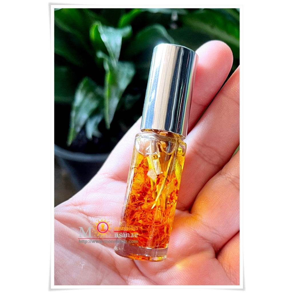Spiritual oil for grace and attraction in a glass rollerball bottle, perfect for positive energy and blessings