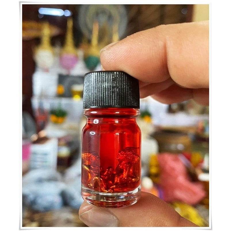 Thai Blessing Co spiritual oil for rekindling love in a small glass bottle with a black cap