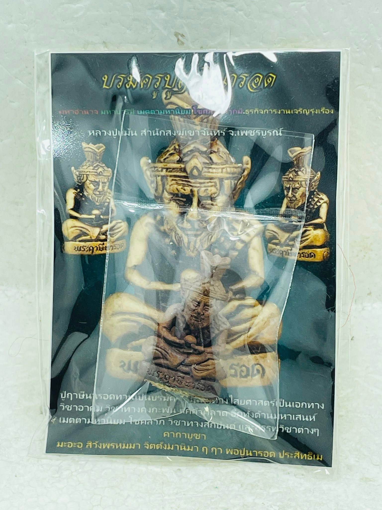 Supreme Ruesi Narot amulet enclosed in protective packaging with detailed instructions for use