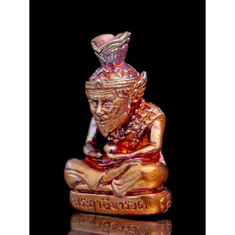 Supreme Ruesi Narot amulet featuring intricate detailing and a seated figure for positive energy