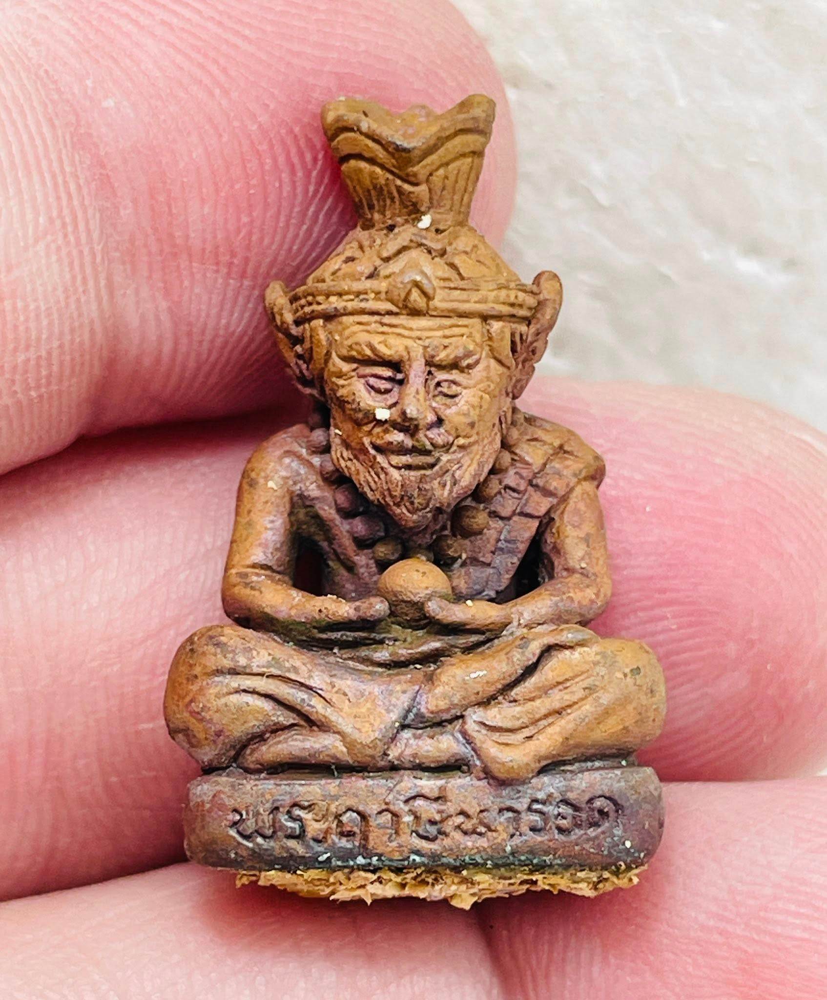 Supreme Ruesi Narot amulet crafted from natural materials, symbolizing good fortune and protection.