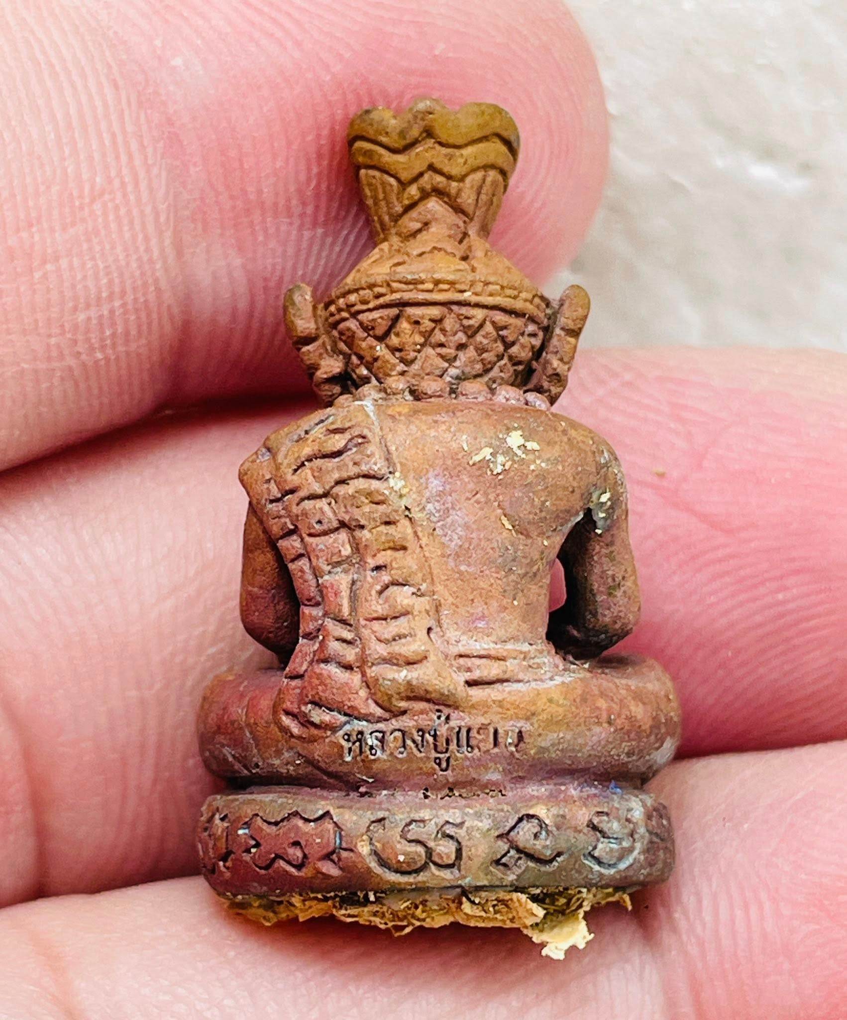Back view of the Supreme Ruesi Narot amulet carved in detail, symbolizing protection and spirituality