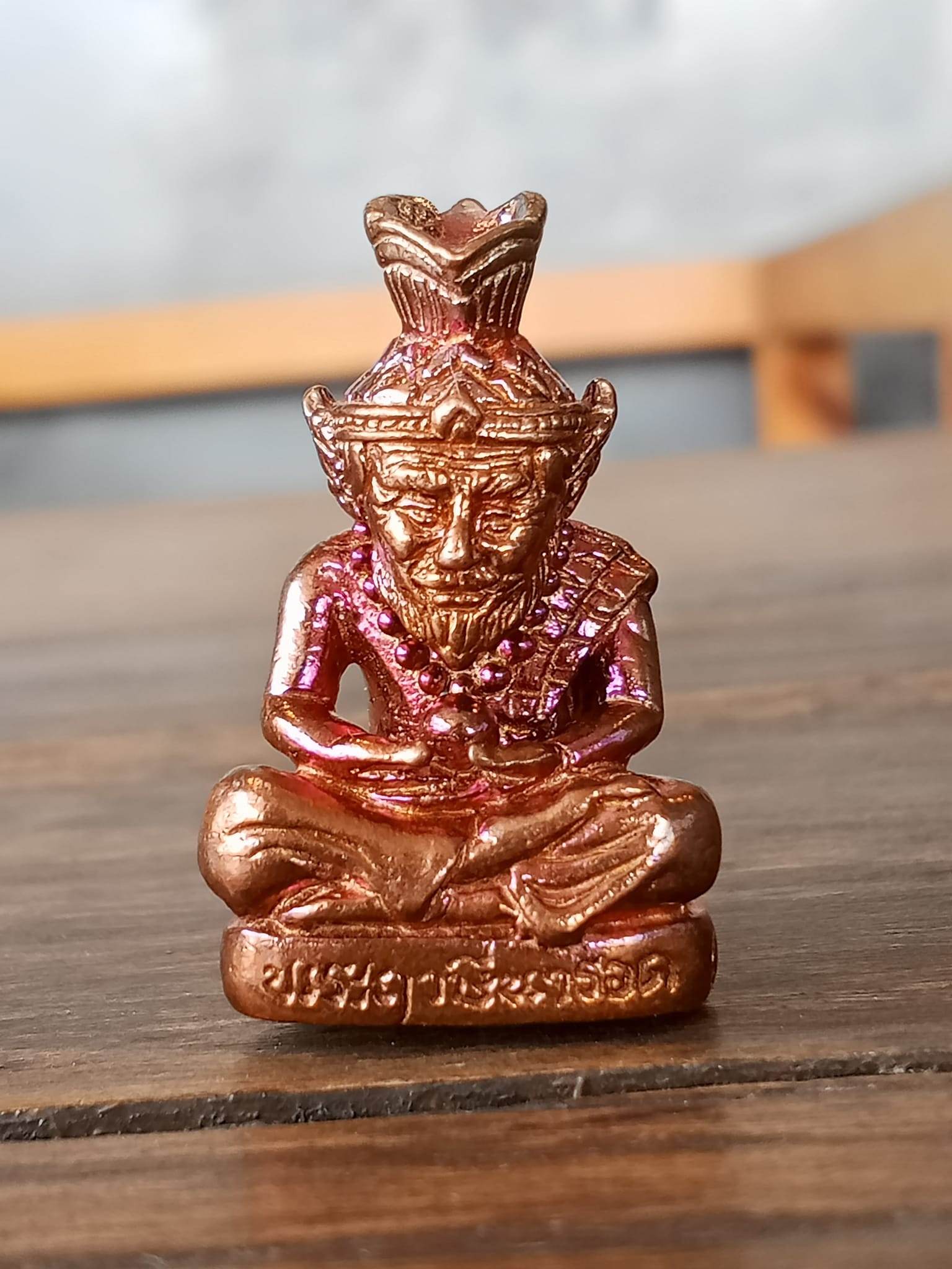 Supreme Ruesi Narot amulet statue in bronze detailing, symbolizing Thai spirituality and protection