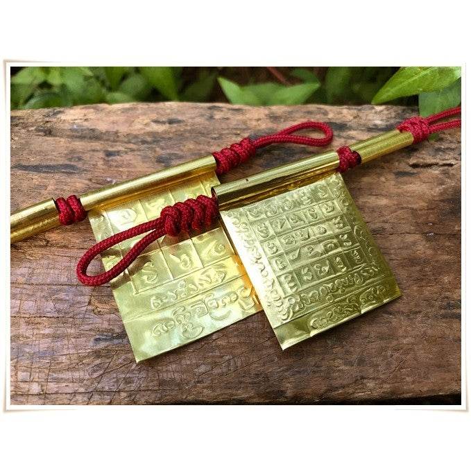 Takrud Maha Phitsawat love charm crafted from brass with intricate designs for spiritual protection