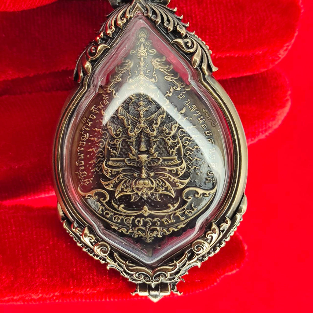 Tao Wessuwan amulet for protection encased in ornate silver with intricate detailing