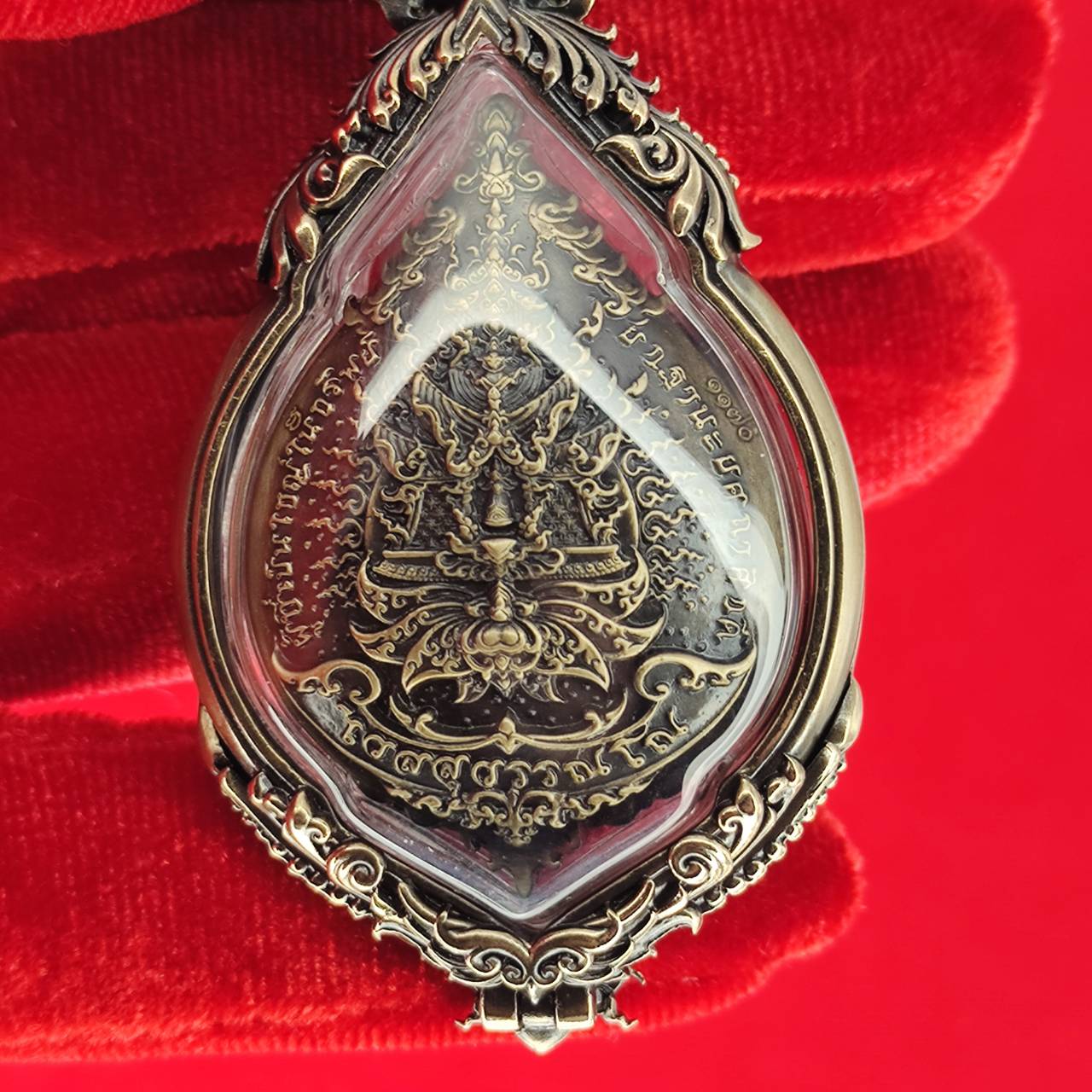 Tao Wessuwan amulet for protection encased in ornate silver with intricate detailing
