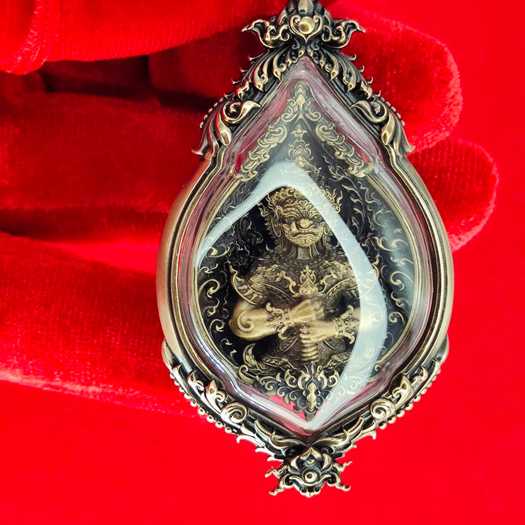 Tao Wessuwan amulet for protection in ornate frame, depicting a guardian deity