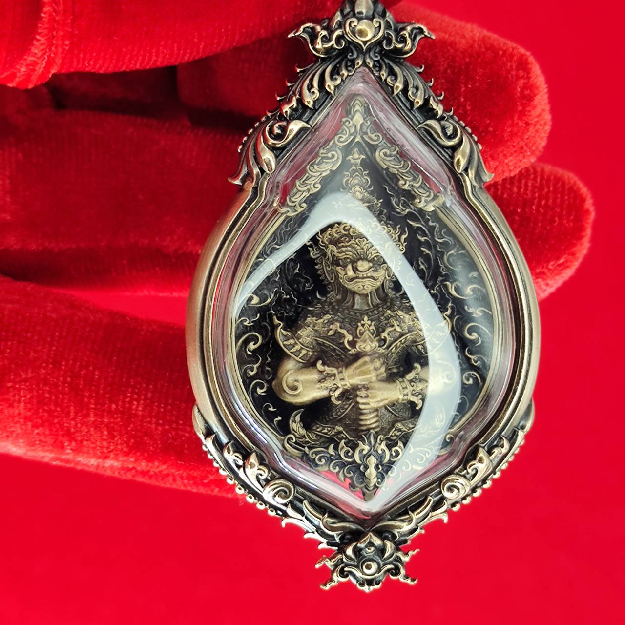 Tao Wessuwan amulet for protection in ornate frame, depicting a guardian deity
