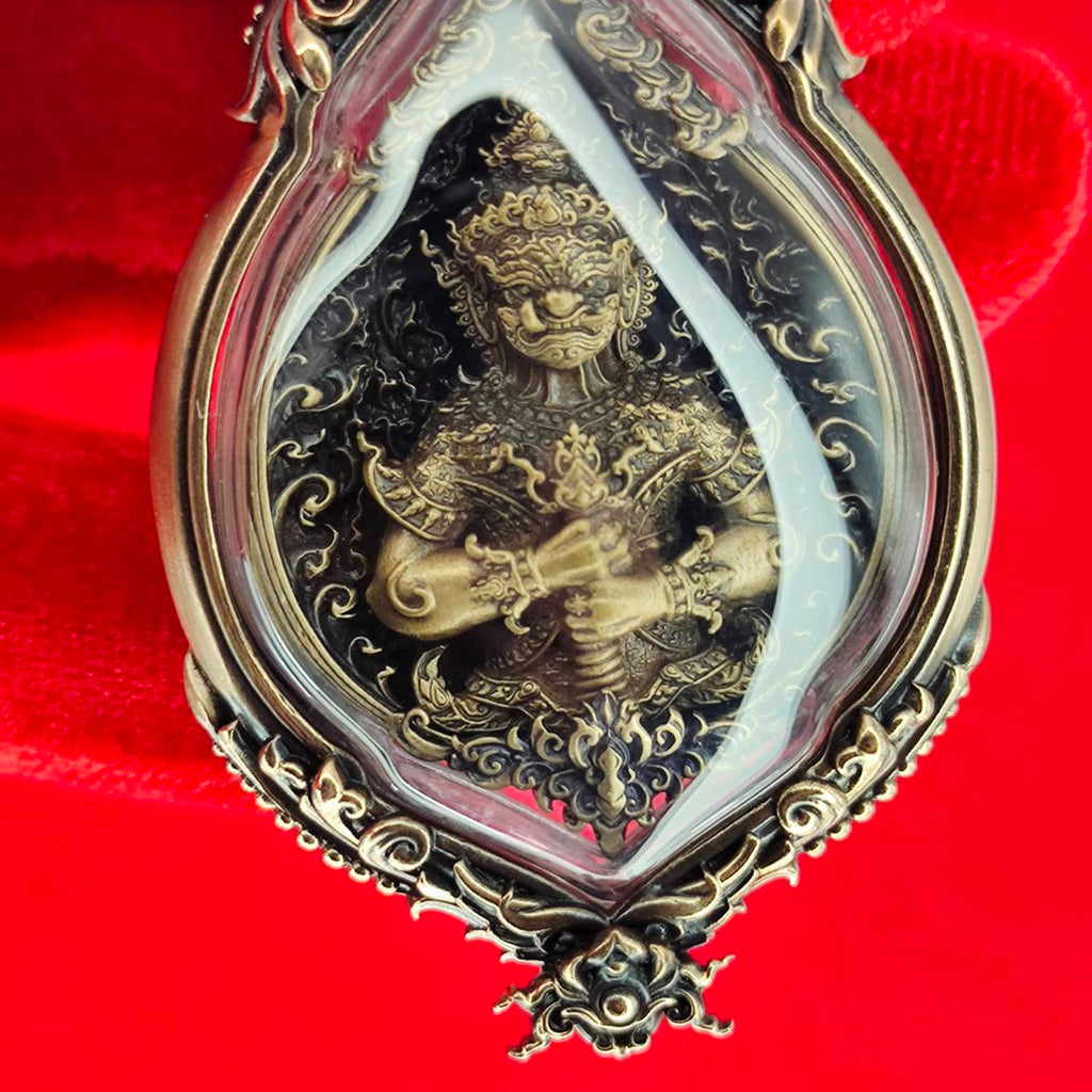 Tao Wessuwan amulet for protection in ornate casing with detailed engraving