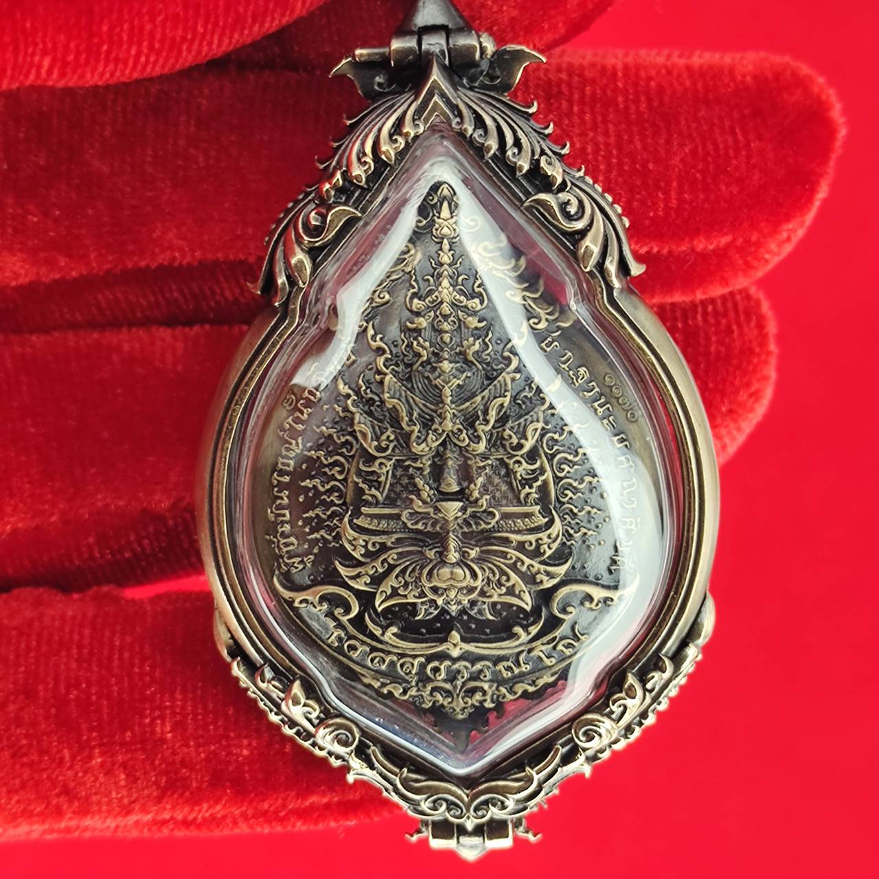 Tao Wessuwan amulet for protection in intricate silver casing, designed for spiritual defense and home decor