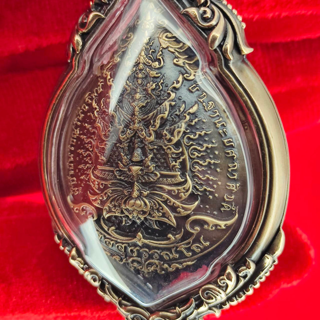 Tao Wessuwan amulet for protection encased in decorative frame with intricate details