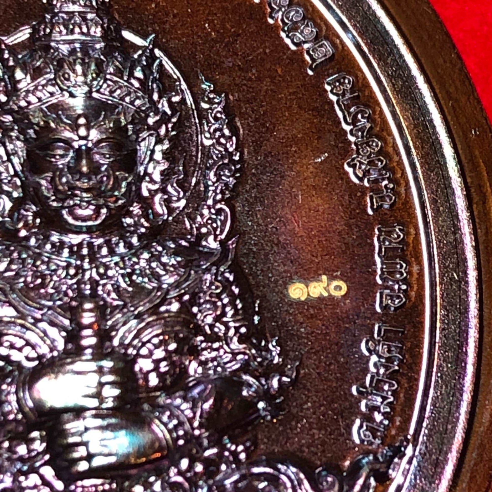 Tao Wessuwan amulet for wealth intricately designed with detailed features and divine symbolism