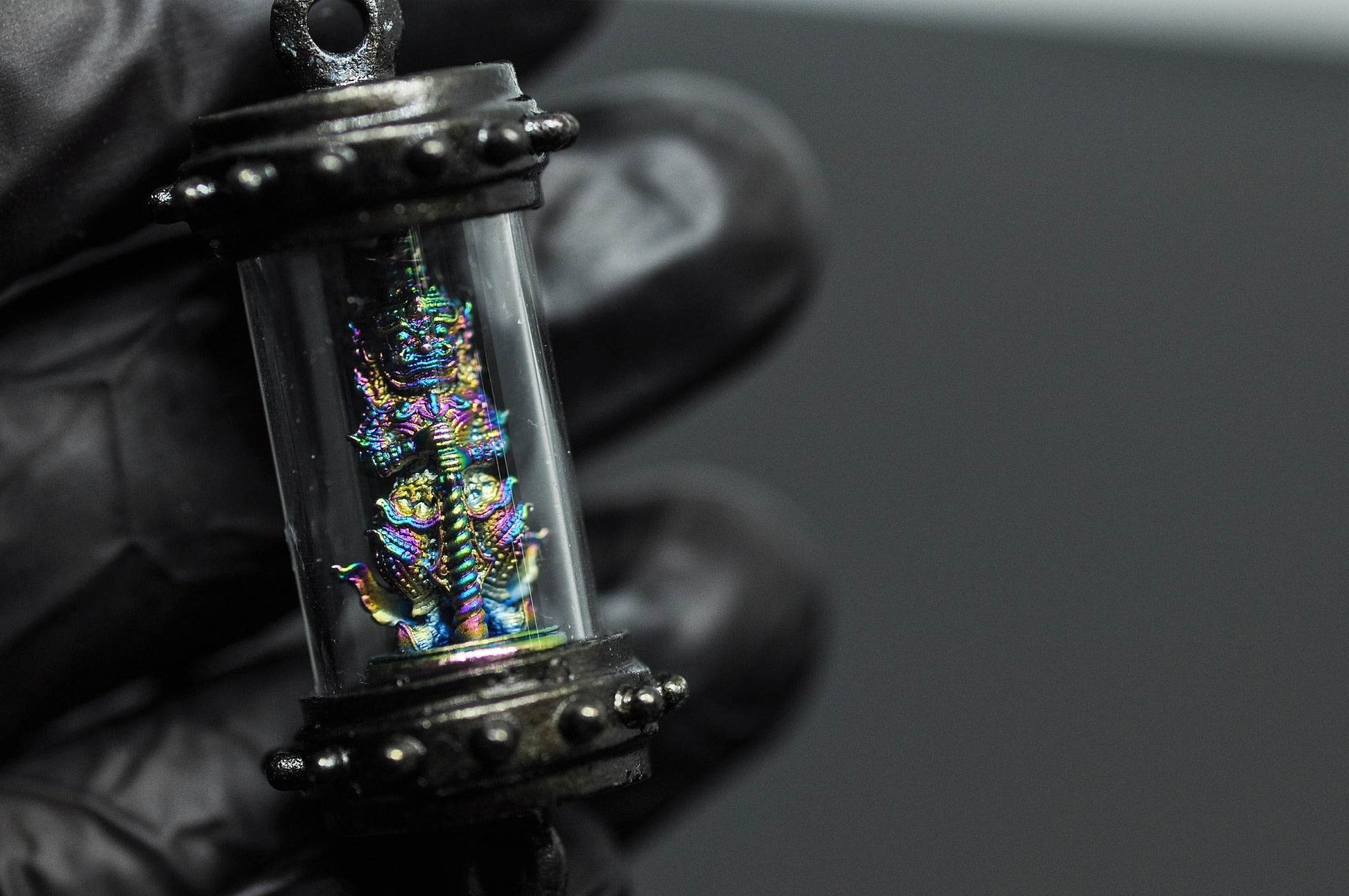 Tao Wessuwan amulet Thailand in a protective casing, crafted for spiritual protection and good fortune