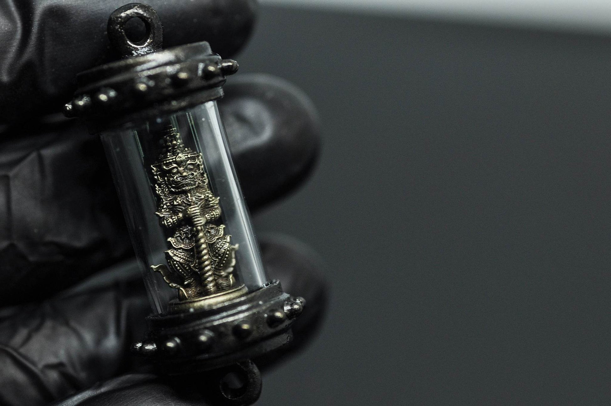 Tao Wessuwan amulet Thailand encased in a clear protective holder for spiritual blessings