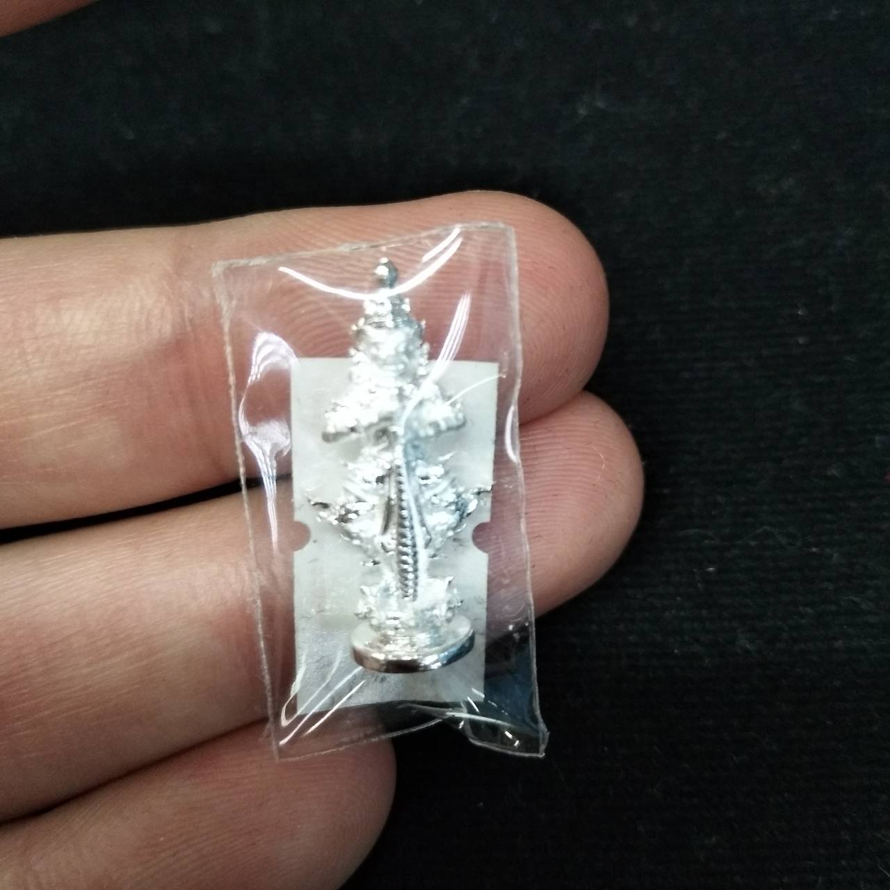 Taow Wessuwan amulet for wealth in protective packaging, ideal for attracting prosperity and good fortune