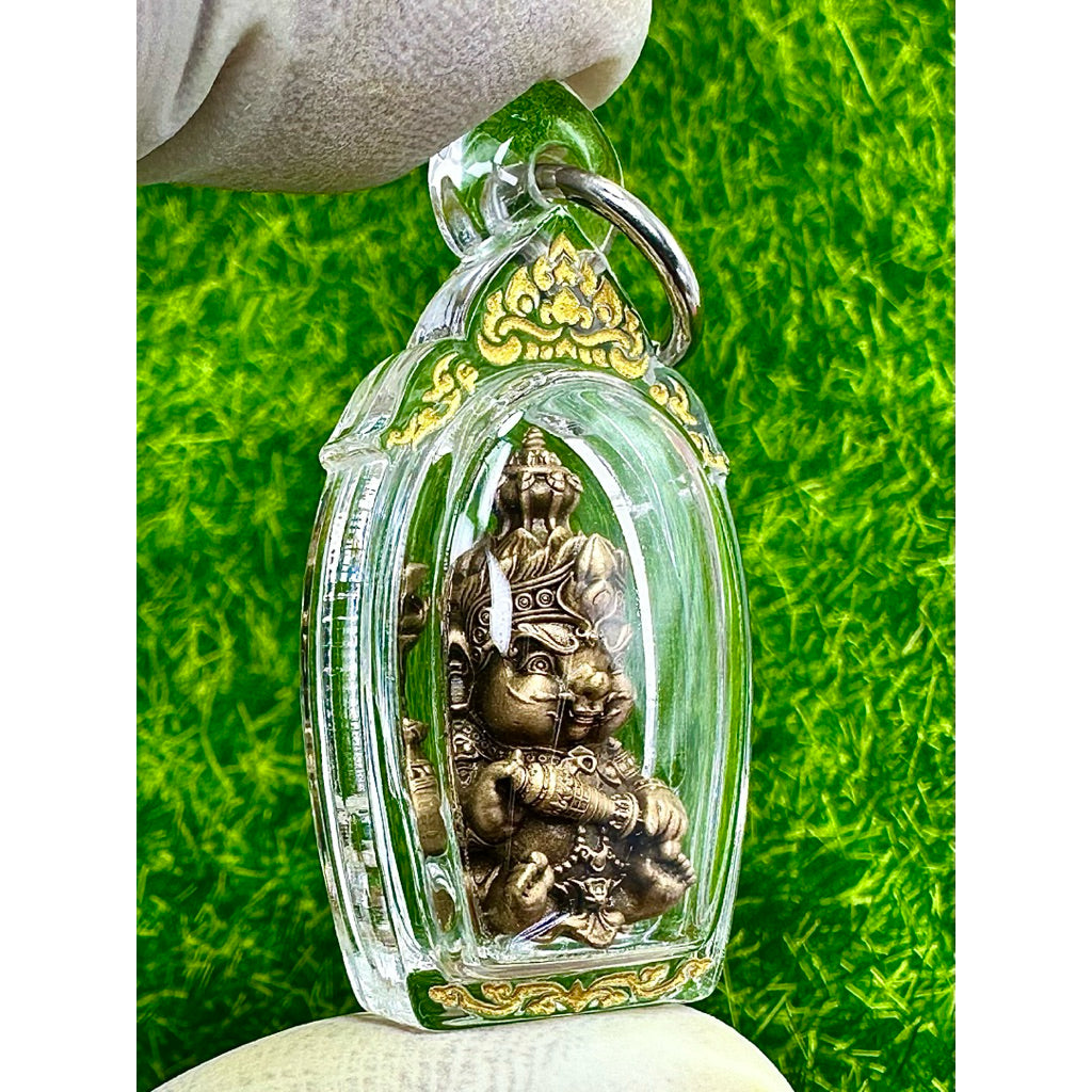 Taowessuwan amulet blessed by monk encased in clear protective cover with gold details