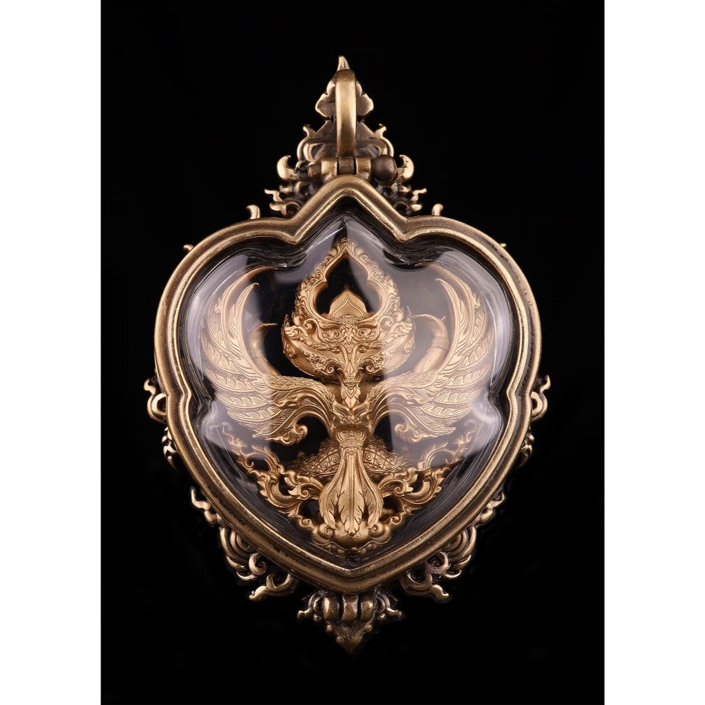 Exquisite Garuda amulet for wealth and protection displayed in a decorative frame with intricate detailing