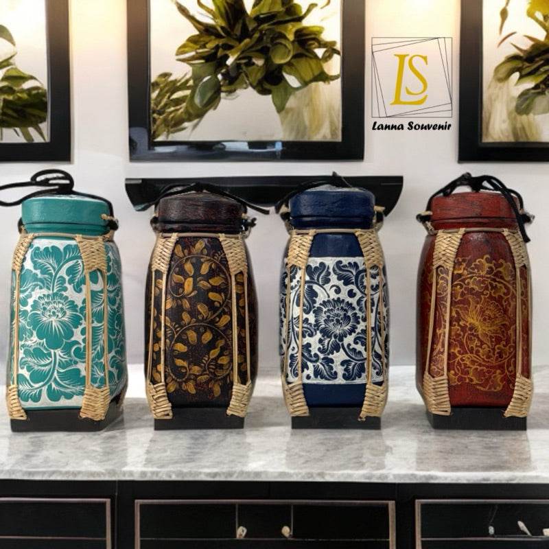 Handmade lanna bamboo rice box set with intricate floral designs in multiple colors on kitchen countertop