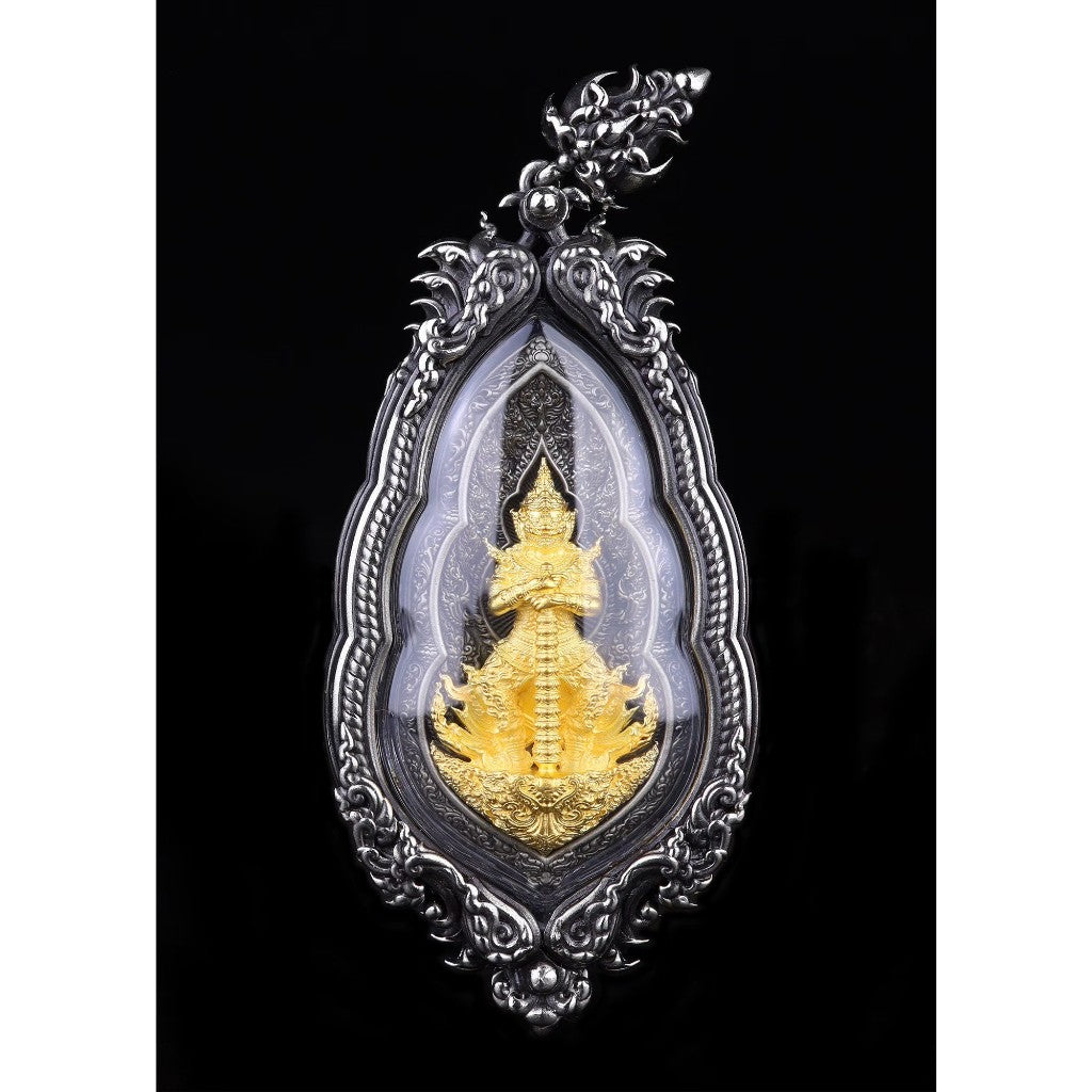 Vesuwanno amulet for wealth and protection encased in an ornate silver frame