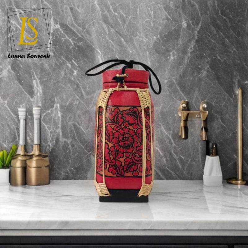 Handmade lanna bamboo rice box with red floral fabric design on marble kitchen countertop