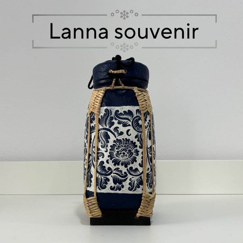 Handmade lanna bamboo rice box with blue floral fabric and intricate woven bamboo design