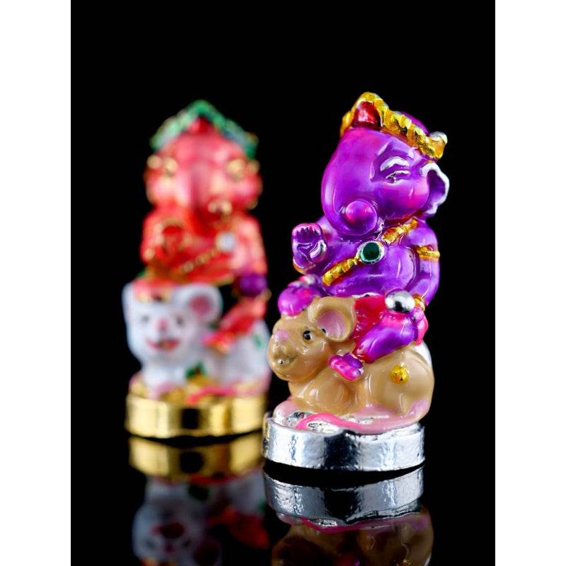 Colorful Ganesha blessing amulet Thailand with purple figure sitting on a mouse, detailed and decorative